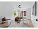 Bright home office with white walls, hardwood floors, stylish lighting, and a comfortable sitting area at 2391 Hudson St, Denver, CO 80207