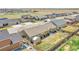 Aerial view of homes in the neighborhood, with backyard and street views from above at 56375 E 22Nd Pl, Strasburg, CO 80136