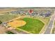 Aerial view of a home located near baseball fields and numerous neighborhood amenities at 56375 E 22Nd Pl, Strasburg, CO 80136