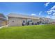 Expansive green backyard featuring a shed, patio area, and well-maintained lawn at 56375 E 22Nd Pl, Strasburg, CO 80136