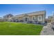Well-maintained backyard with patio, seating, and landscaping, offering a serene outdoor retreat at 56375 E 22Nd Pl, Strasburg, CO 80136