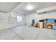 Unfinished basement area, showcasing the blank canvas for future customization with lighting at 56375 E 22Nd Pl, Strasburg, CO 80136