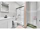 Modern bathroom featuring a glass-enclosed shower, sleek vanity, and contemporary fixtures at 56375 E 22Nd Pl, Strasburg, CO 80136