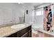 Cozy bathroom with vanity, tub/shower combo, and decorated with a patterned shower curtain at 56375 E 22Nd Pl, Strasburg, CO 80136
