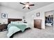 Comfortable bedroom boasts a walk-in closet, an ensuite bathroom, and tasteful furnishings at 56375 E 22Nd Pl, Strasburg, CO 80136