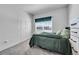 Comfortable bedroom featuring a large closet, a large window, soft carpet, and ample space at 56375 E 22Nd Pl, Strasburg, CO 80136
