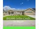 Charming single-story home featuring a well-manicured lawn, inviting porch, and an attached two-car garage at 56375 E 22Nd Pl, Strasburg, CO 80136