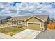 Beautiful single story home with a two car garage and a charming front porch at 56375 E 22Nd Pl, Strasburg, CO 80136