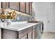 Laundry room with counter space and storage, as well as a sleek washer and dryer at 56375 E 22Nd Pl, Strasburg, CO 80136