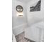 Carpeted stairway with white trim and neutral walls leads to the upper level of the home at 56375 E 22Nd Pl, Strasburg, CO 80136