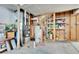 Basement mechanical room showcasing the home's water heater, furnace and shelving at 56375 E 22Nd Pl, Strasburg, CO 80136