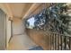 Relax on this charming balcony with views of mature trees and the neighborhood at 8060 E Girard Ave # 311, Denver, CO 80231