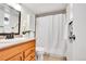 Standard bathroom features a single sink vanity, toilet, and bathtub with shower at 8060 E Girard Ave # 311, Denver, CO 80231