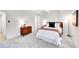 Cozy bedroom featuring soft carpeting, a stylish mid-century modern cabinet, and comfortable decor at 8060 E Girard Ave # 311, Denver, CO 80231