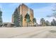 Brick building with multiple stories and manicured landscaping, offering a serene and inviting atmosphere at 8060 E Girard Ave # 311, Denver, CO 80231