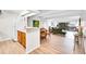 Open floor plan featuring hardwood floors, white walls, recessed lights, and stylish decor and balcony at 8060 E Girard Ave # 311, Denver, CO 80231