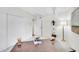 Office features soft carpet, a large wooden desk, a sleek floor lamp, and a white shelving unit at 8060 E Girard Ave # 311, Denver, CO 80231