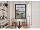 Cozy eating nook with a table and chairs, natural light, and a modern shelf at 444 17Th St # 205, Denver, CO 80202