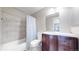Bathroom with modern vanity, tile surround shower, and updated fixtures at 18274 W 58Th Pl # 37, Golden, CO 80403