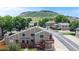 Exterior view of the house with a deck and a mountain in the background at 18274 W 58Th Pl # 37, Golden, CO 80403