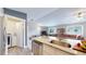 Modern kitchen featuring stainless steel appliances and view of the fireplace in the living room at 18274 W 58Th Pl # 37, Golden, CO 80403