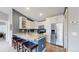 Modern kitchen with stainless steel appliances, white cabinets, and granite counters at 18274 W 58Th Pl # 37, Golden, CO 80403