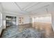 Large unfinished basement with concrete floors, recessed lighting, and access to outdoor area at 15377 W Iliff Dr, Denver, CO 80228