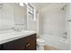 Clean bathroom featuring shower-tub combo, and neutral finishes at 15377 W Iliff Dr, Denver, CO 80228