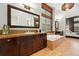 Well-appointed bathroom features a soaking tub, tiled floor, double sink vanity, and window at 15377 W Iliff Dr, Denver, CO 80228