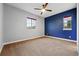 Comfortable bedroom with neutral carpet and picturesque windows at 15377 W Iliff Dr, Denver, CO 80228