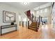 Grand foyer featuring hardwood floors, modern staircase, and an open layout with lots of natural light at 15377 W Iliff Dr, Denver, CO 80228