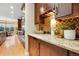 Kitchen area with mosaic tile backsplash, granite countertops, and stainless steel appliances at 15377 W Iliff Dr, Denver, CO 80228