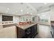 Gourmet kitchen open to the finished basement at 15377 W Iliff Dr, Denver, CO 80228