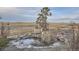 Beautiful outdoor area featuring a pond, bench, and scenic landscape view at 754 Highway 86 Hwy, Elizabeth, CO 80107