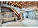 Unfinished basement with exposed beams, storage shelves, and utility equipment ready to be customized at 754 Highway 86 Hwy, Elizabeth, CO 80107