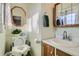 Functional bathroom featuring a vanity sink, an octagonal mirror, and safety enhancements to the toilet at 754 Highway 86 Hwy, Elizabeth, CO 80107
