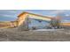 Exterior shot of outbuilding with a mountain mural on the side, showcasing creative design at 754 Highway 86 Hwy, Elizabeth, CO 80107