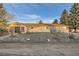 Ranch style home with a spacious yard, mature trees, and covered patio area at 754 Highway 86 Hwy, Elizabeth, CO 80107