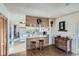 Open kitchen featuring a breakfast bar, updated appliances, and convenient access to the adjacent rooms at 754 Highway 86 Hwy, Elizabeth, CO 80107