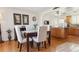 Dining room adjacent to the kitchen with hardwood floors and recessed lighting at 13106 W Chenango Ave, Morrison, CO 80465