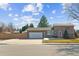 Charming home featuring a stone facade, two-car garage, and a well-maintained front yard at 13106 W Chenango Ave, Morrison, CO 80465