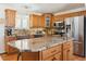Spacious kitchen with granite countertops, stainless steel appliances, and custom cabinets at 13106 W Chenango Ave, Morrison, CO 80465