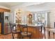 Open kitchen with granite island, stainless steel appliances, and hardwood flooring at 13106 W Chenango Ave, Morrison, CO 80465