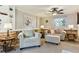 Cozy living room with wainscoting, neutral-colored furniture, and warm lighting at 13106 W Chenango Ave, Morrison, CO 80465