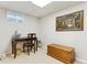 Basement office space with a desk, chair, and a storage chest at 13106 W Chenango Ave, Morrison, CO 80465