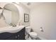 Well-lit half-bath features a vessel sink and modern fixtures at 3792 S Dallas St, Aurora, CO 80014