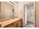 Bathroom with an open door to another bathroom featuring a shower and toilet at 3792 S Dallas St, Aurora, CO 80014