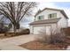 Two-story house with attached garage and mature landscaping at 201 Quail Ridge Cir, Highlands Ranch, CO 80126