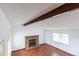 Living room with brick fireplace and hardwood floors at 201 Quail Ridge Cir, Highlands Ranch, CO 80126