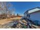 Backyard featuring a two-story house with stairs and a patio area, ideal for outdoor entertaining and relaxation at 15640 E Eldorado Dr, Aurora, CO 80013
